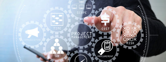 A finger points at a graphic of a handful of business tools with Project Management in the center.