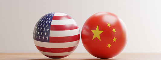 A American and Chinese flag next to one another.