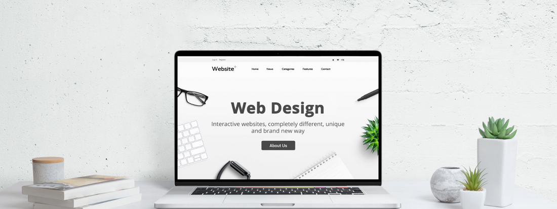 A white website design with a banner and CTA on a laptop screen in a white room.