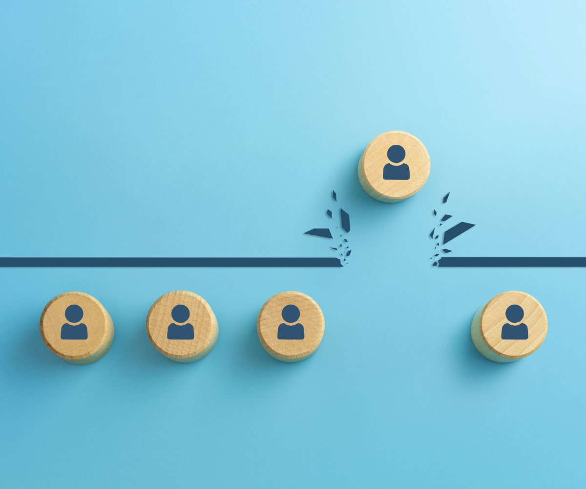 5 wooden circles with a person symbol printed on them. The 4th in the line is breaking through a cartoon ceiling above the rest.