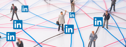 LinkedIn logos attached to individual business characters all connected by a network of lines.