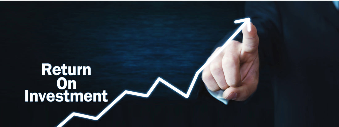 return on investment with a finger tracing a line graph up
