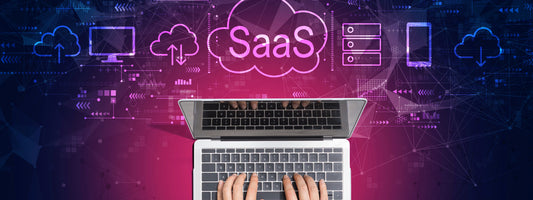 SaaS banner with a laptop and SaaS cloud graphics above it.
