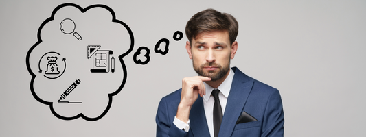 Business man with a blue suit with a thought bubble next to him inside there is a magnifying glass, pen, creative dashboard, and money symbol.